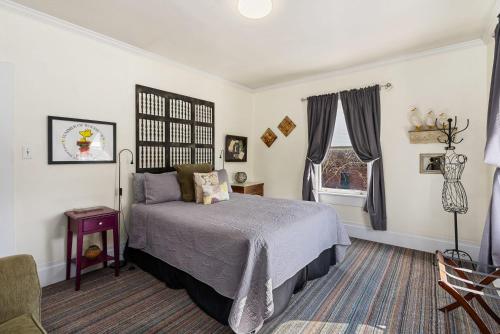 a bedroom with a bed and a window at Cannery Loft @ Railroad Square in Santa Rosa