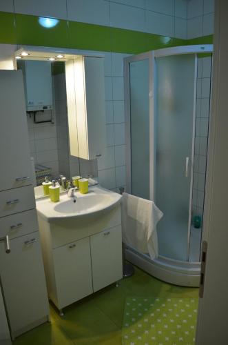 a bathroom with a sink and a shower at Apartment Meli in Sesvete