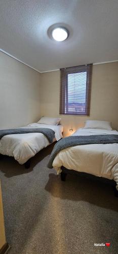 Cama o camas de una habitación en Alojamiento San Pedro de la Paz