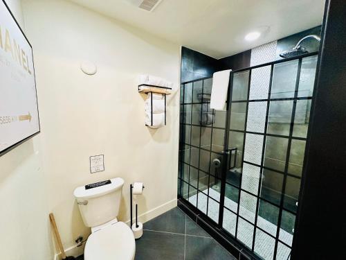 a bathroom with a toilet and a shower at Bespoke Inn Flagstaff in Flagstaff