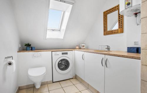 a white laundry room with a washer and dryer at Beautiful Apartment In Dalmose With Wi-fi 