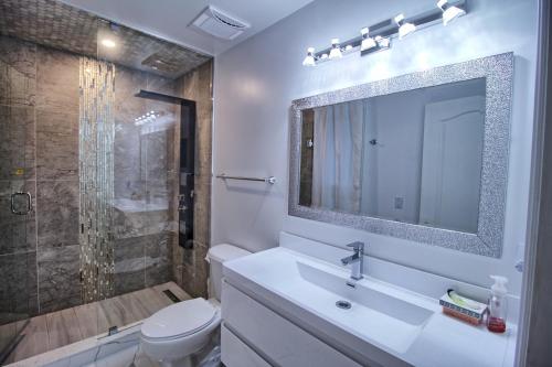 a bathroom with a sink and a toilet and a shower at Master Room with Private Bathroom and Free Parking in Vaughan