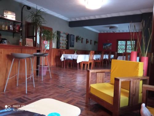 a dining room with a table and chairs at L'anis Etoilé - Hôtel Restaurant in Antsirabe