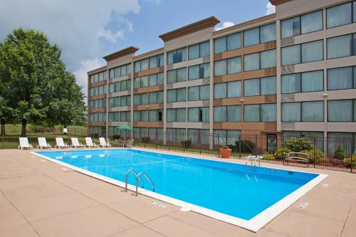 a swimming pool in front of a building at Holiday Inn Weirton-Steubenville Area in Weirton