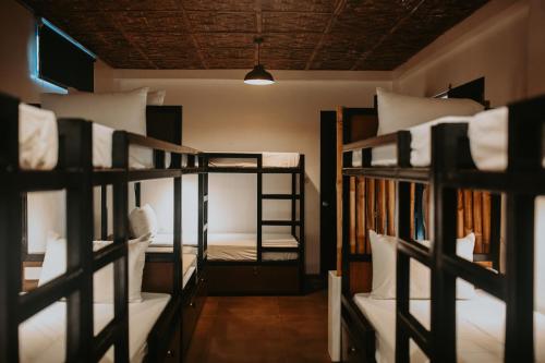 a group of bunk beds in a room at Everyday Sunday Hotel & Cafe in Bantayan Island