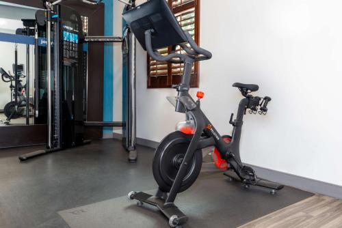 a gym with an exercise bike and a treadmill at Hampton Inn Savannah Historic District in Savannah