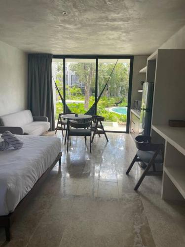 Ένα ή περισσότερα κρεβάτια σε δωμάτιο στο Tulum Sweet Condo with private pool