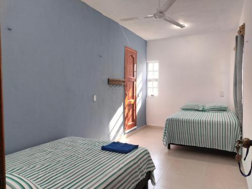 Katil atau katil-katil dalam bilik di Casa en VILLA GABRIELA