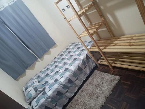 Un pat sau paturi într-o cameră la Axel costa