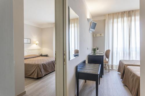 Postel nebo postele na pokoji v ubytování Grand Hotel Bonanno