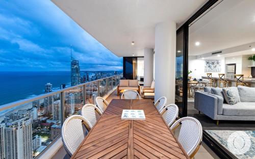 a dining room with a view of the ocean at 5 Bedroom Executive Sub Penthouse in the heart of Surfers with full ocean views - Sleeps 12 - Circle on Cavill AMAZING!! in Gold Coast