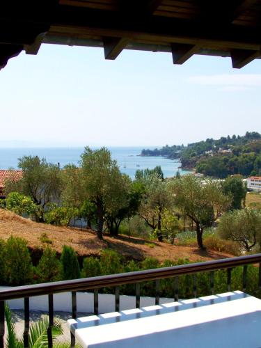 a view of the ocean from a balcony at Villa Anna Maria in Agia Paraskevi