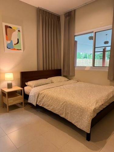 Säng eller sängar i ett rum på Two bedroom Villa Mango