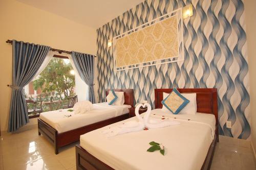 Lova arba lovos apgyvendinimo įstaigoje Ocean Place Mũi Né Resort - by Bay Luxury