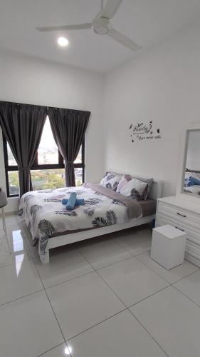 a bedroom with a bed and a large window at Horizon Delux Suite @ Ipoh Town in Ipoh