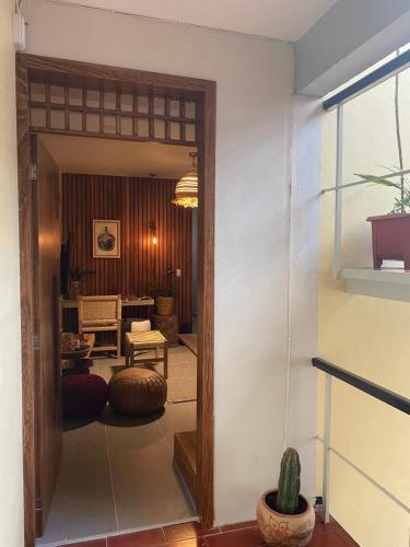 a living room with a view of a room with at Layoo, Tu Casa en Oaxca 105 in Oaxaca City