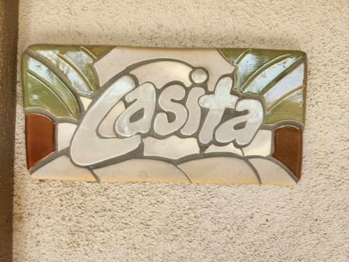 a tile with the word asahi on a wall at Trilogy Polo Club - Casita in Indio