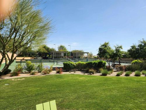 a park with two tennis courts in the background at Trilogy Polo Club - Casita in Indio