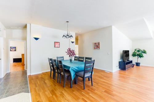 a dining room with a blue table and chairs at Zerenity Lookout East in Oakhurst
