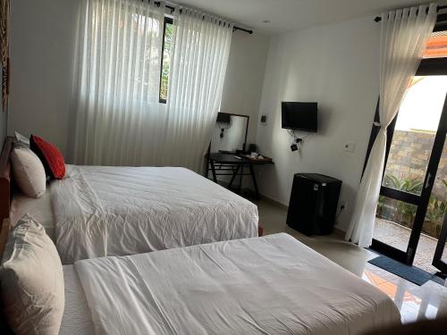 Tempat tidur dalam kamar di Water Palm Residence