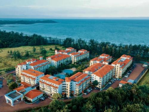 an aerial view of a building near the ocean at Desaru Private Beach Family Suite Big Pool D0513 in Bandar Penawar