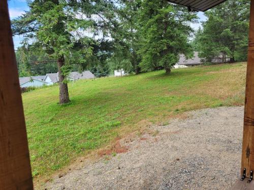 a view of a field from the porch of a house at Wells Gray Stay And Play in Clearwater