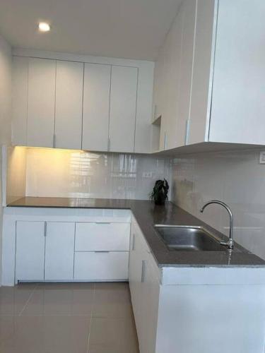a white kitchen with a sink and white cabinets at Japandi Home A - Fully Aircon, WIFI, Hot shower, 24hGuard, Center, near Malls in General Santos