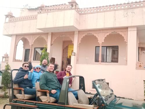 a group of people riding in the back of a truck at The Vantage Haveli in Sawāi Mādhopur
