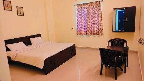 Voodi või voodid majutusasutuse Hotel Nawab's toas