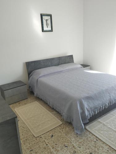 Posteľ alebo postele v izbe v ubytovaní Casa vacanza ANNA con vista balcone La Laguna ,situata a 5 minuti dal centro a piedi