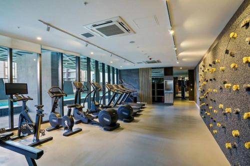 a gym with several treadmills and cardio machines at Luxury 1 Bedroom Apartment in Adelaide CBD - 1 minute walk to Rundle mall - Free Wifi & Netflix in Adelaide