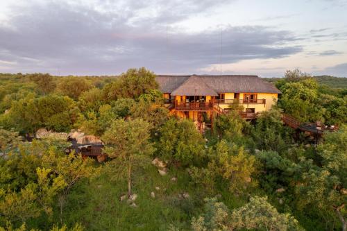 an aerial view of a house in the forest at Parsons House in Hoedspruit
