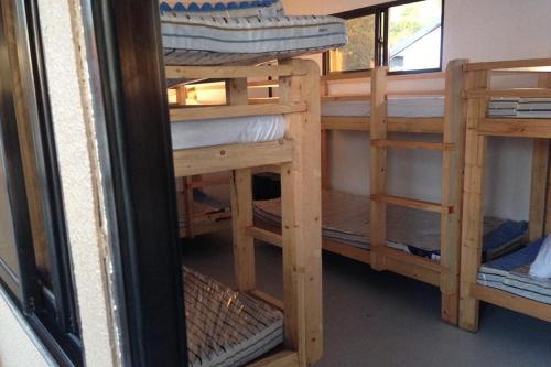 a group of bunk beds in a room at Surfer's Point Deck in San Juan