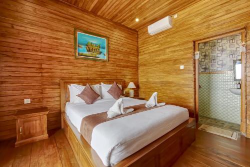 Katil atau katil-katil dalam bilik di Penida La Casa Cottage