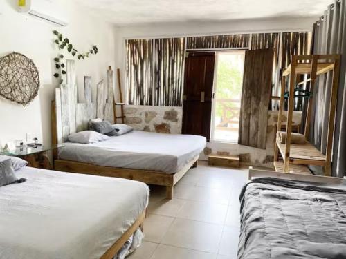 Ένα ή περισσότερα κρεβάτια σε δωμάτιο στο Villa Azul Xulha