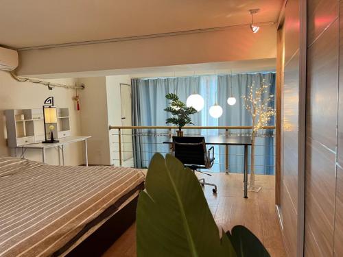 a bedroom with a bed and a balcony at Chaoyang Joy City Hardcover Apartment in Beijing