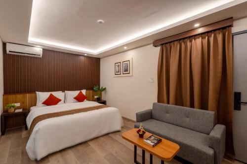 Postel nebo postele na pokoji v ubytování Everyday Hotel Kuta Central