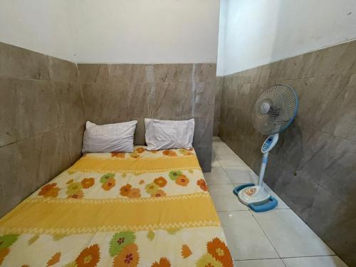 Кровать или кровати в номере SPOT ON 93755 Siwalanpanji Homestay Syariah