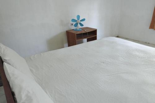 Кровать или кровати в номере Hotel O Madame Guesthouse