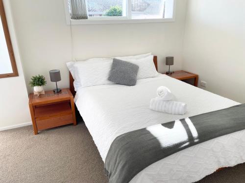 Katil atau katil-katil dalam bilik di Your home at Cockle Bay