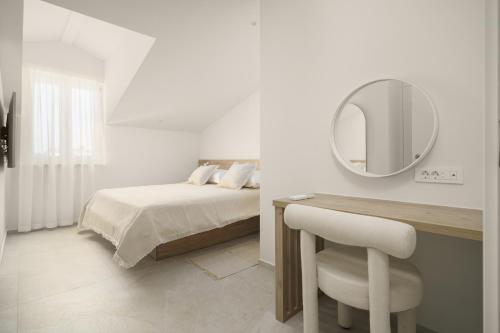 En eller flere senge i et værelse på Penthouse villa Bianca Vodice