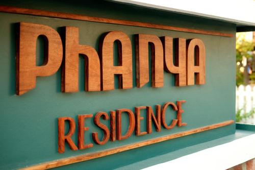 a sign for a restaurant on the side of a building at PHA NYA RESIDENCE in Luang Prabang