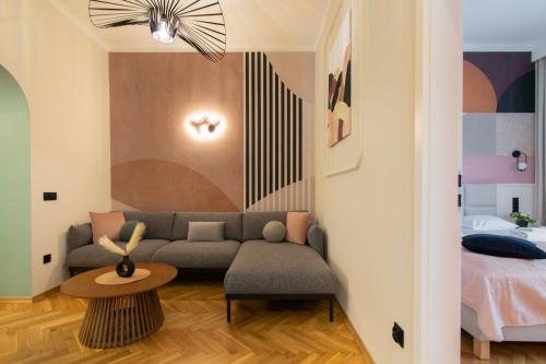 a living room with a couch and a bed at Central Apartments Warszawska Street in Krakow