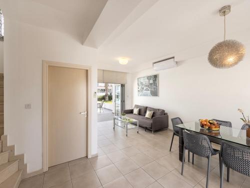 a living room with a table and a couch at Villa Nora in Protaras