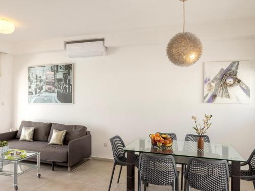 a living room with a couch and a table at Villa Nora in Protaras