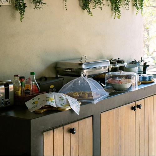 a kitchen counter with some food on top of it at The Baobab Bush Lodge and Villa in Hoedspruit