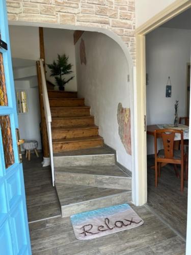 a room with a staircase with a rug on the floor at Istrian house Mojca in Koper