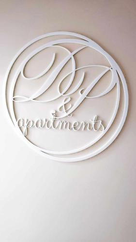 a metal sign with the name of a restaurant at DiP HOME APARTMENTS in Pomorie