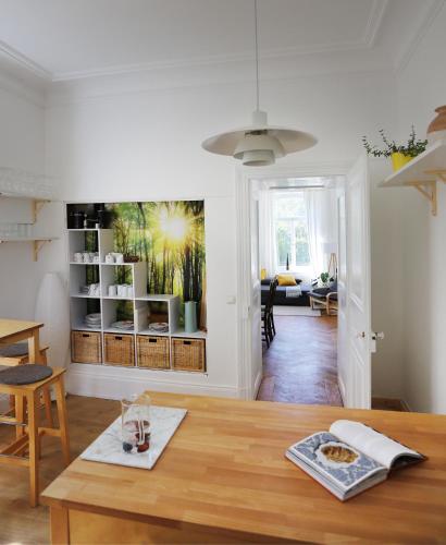a living room with a table and a dining room at Magnetfels in Lenzkirch