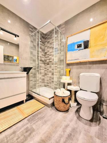 a bathroom with a toilet and a shower at NEW - Epic Design -AC, Balcony, Free Parking in Linda-a-Velha
